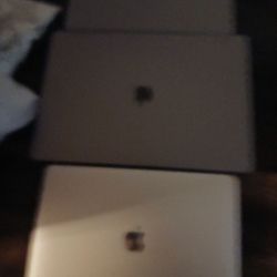 O Have Three Apple Laptop 