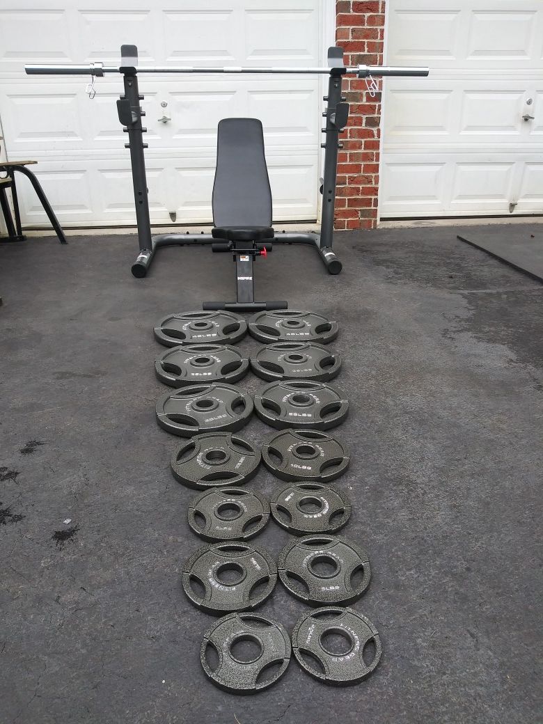Home gym. New rack, New low profile Bench, New 300 lbs Olympic weight set.