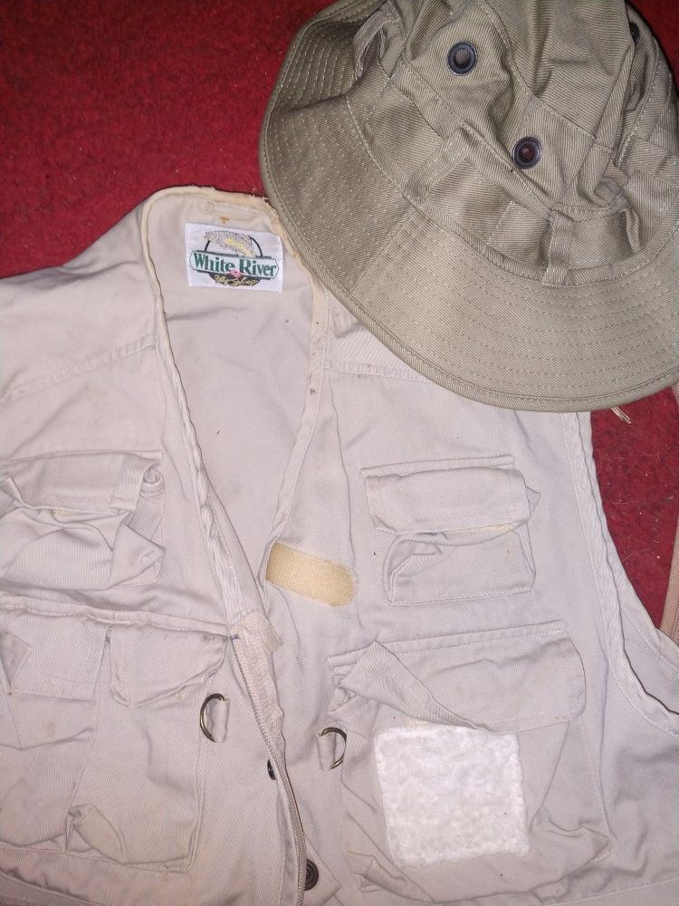 Bass pro fishing vests (2) hat(1) waders(1) assorted tackle and a puma jacket