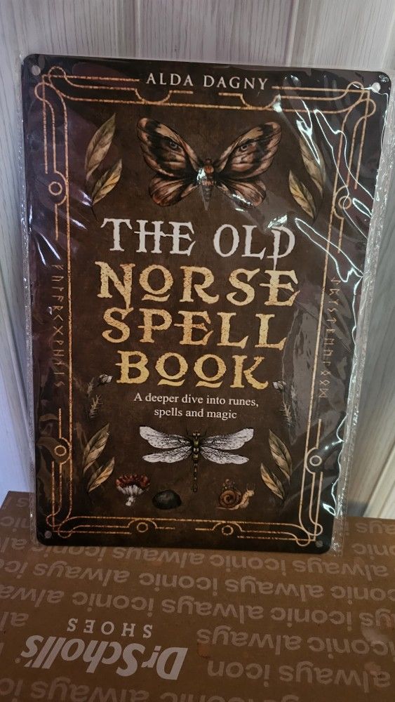Vintage "The Old Norse Spell Book" Metal Sign
