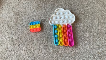2 pop its, one big cupcake, and one little square keychain