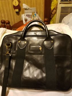 Property of leather brief case