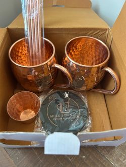 Moscow Mule pair of copper mugs, 4 copper straws, copper shot glass, and 4 drink coasters.