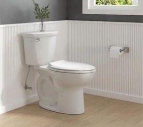 American Standard Cadet 12 in. Antimicrobial 2-Piece 1.28 GPF Single Flush Chair Height Elongated Toilet with Slow Close Seat in White