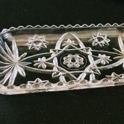 Anchor Hocking EAPC 12" Oval Relish And Vintage Anchor Hocking Gondola Dish: Clear Glass, Flower Star Pattern, Scalloped Edges.

Measures 9 1/4" long
