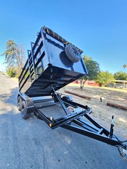 NEW DUMP TRAILER 12X8X4 12000 LBS
ROLLING TARP--SPARE TIRE,ELECTRIC BRAKES,HYDRAULIC SYSTEM,REMOTE CONTROL,IDEAL FOR HAULING, DEMOLITION, TRASH ETC,