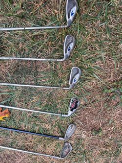 Used golf clubs and Seahawks bag