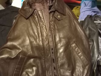 Brown large dress leather jacket . It's been in plastic over two years,