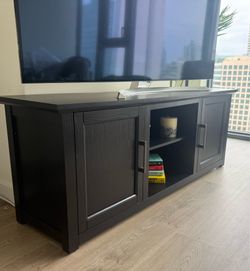 TV stand with great storage. Almost brand new but need to sell due to move