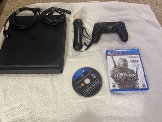 PS4 with 1 controller, 1 motion controller, and 2 games