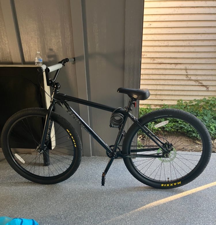 Large black throne BMX bike 29’ Wheel