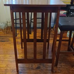Brown Table With Two Stools