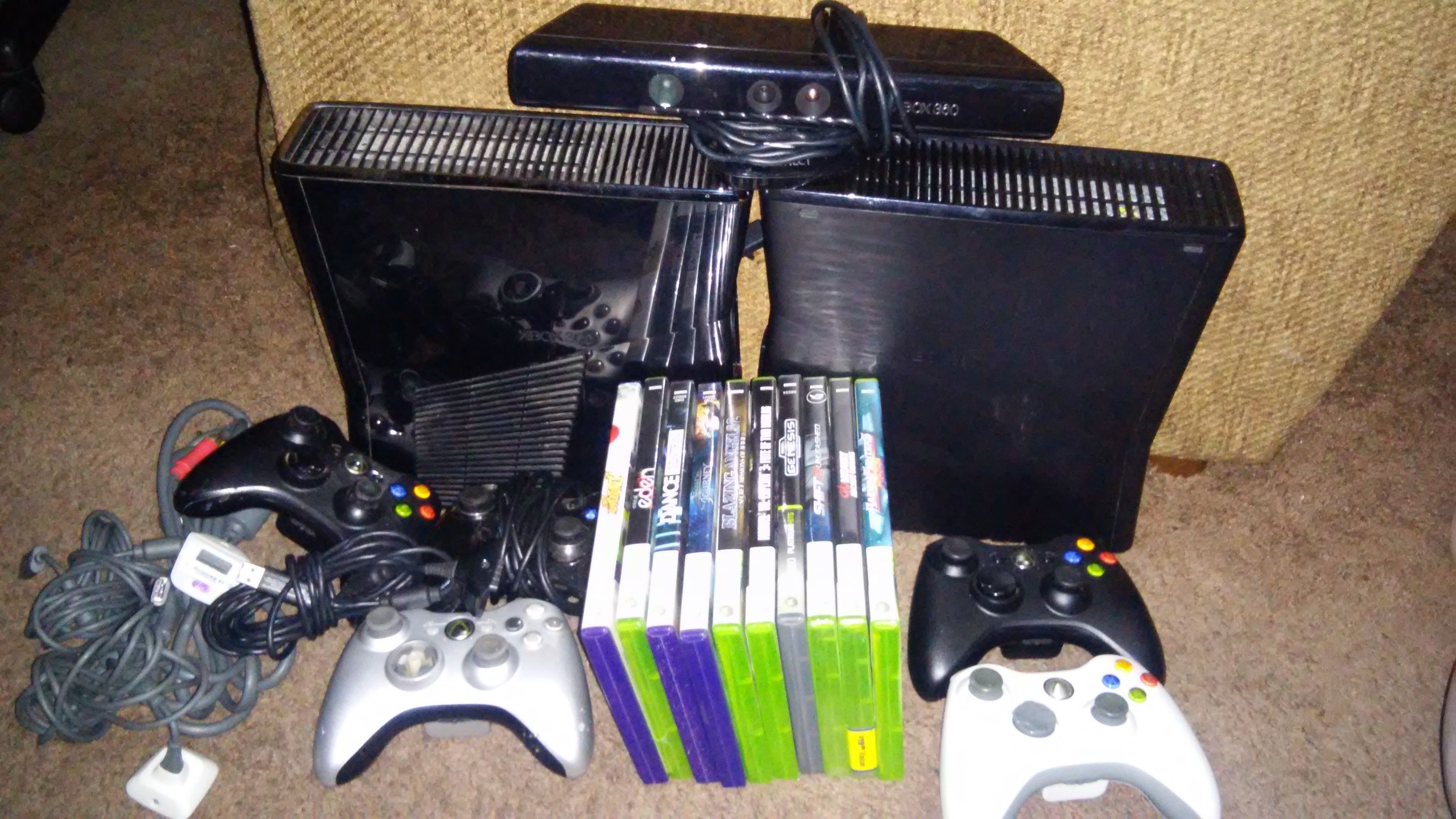 2 xboxs 360 slims with10games& 5 controllers