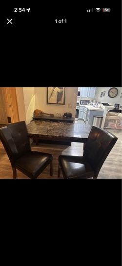 Wood table with 4 leather chairs