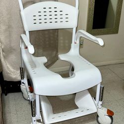 Rolling shower/commode chair