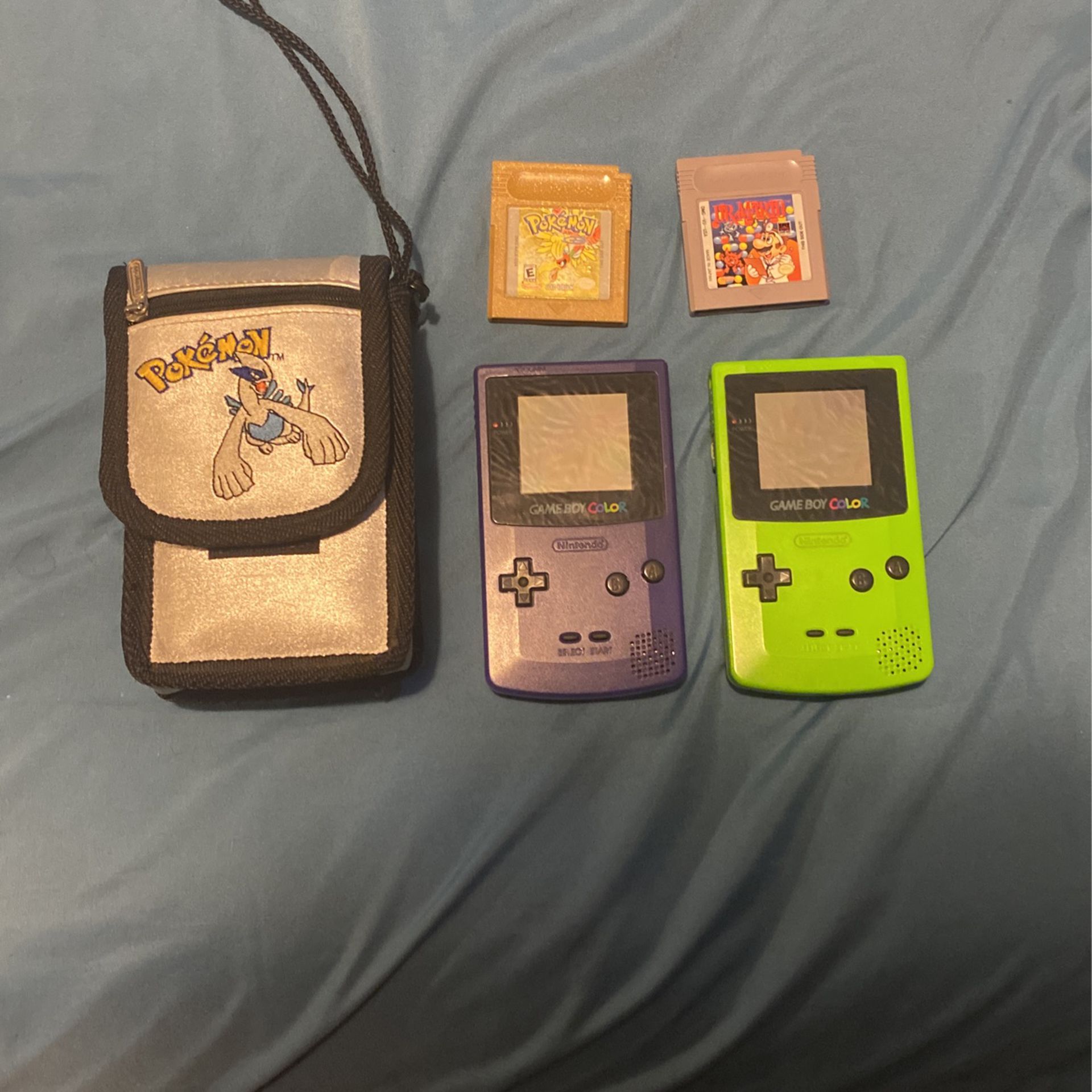 2 game boy colors with 2 games and case