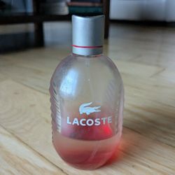 Lacoste Red Eau De Toilette Spray Mens 2.5 oz. Used 25% available in bottle. 