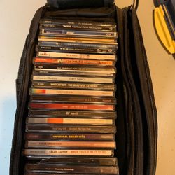 CDs and Leather Travel Case