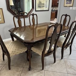 Solid 6 piece wood table with 6 chairs.