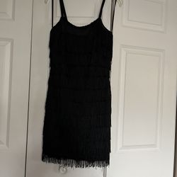 It’s Very Cute Short Cocktail Dress The Size Is Six. The Color Is Black. It’s All Tassel.Dress 