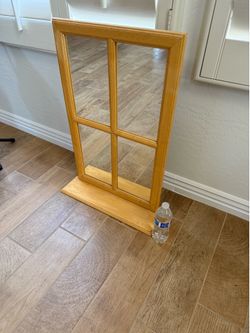 Wall mirror with shelf