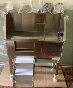 Stainless steel dog washing and grooming tub.