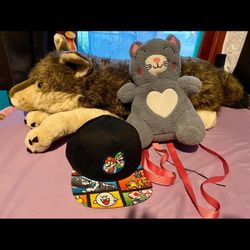 Giant Wolf Plushie $10/ Cat Backpack $5/ Mario Hat $3