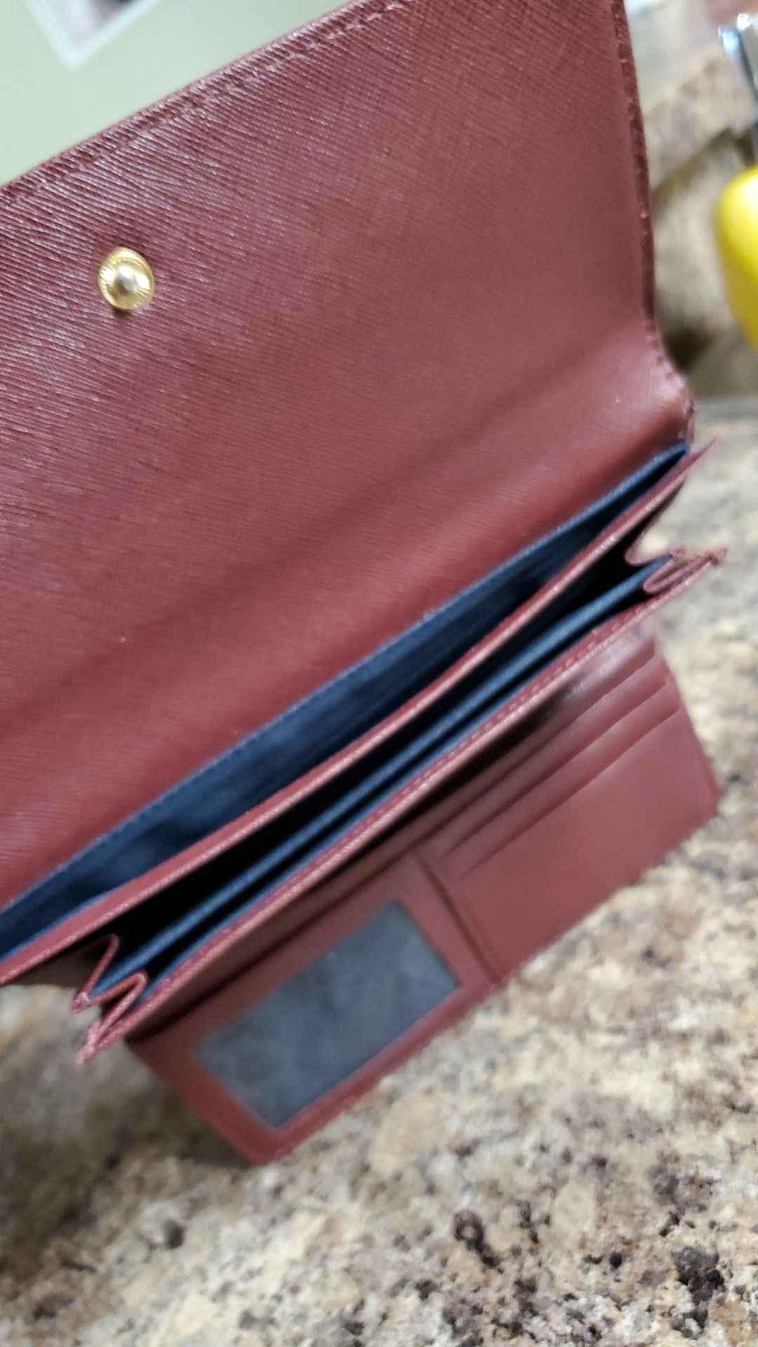 Maroon Tommy Hilfiger wallet.