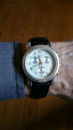 Ecclissi, Sterling Silver and 14K gold watch.