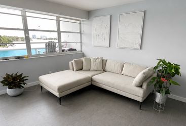Light Gray Sectional Sofa with Ottoman – Good Condition