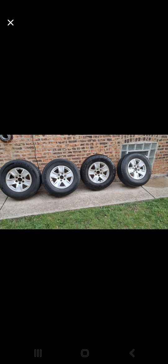 4 Tires with 17" GM Rims – Ready to Roll! P265/70R17