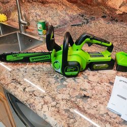 Brand New Greenworks 12in . Chainsaw With Battery 4AH. And Charger 