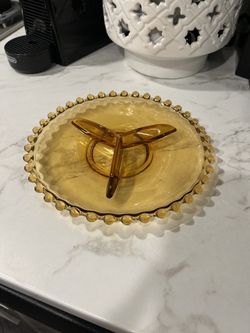 vintage amber glass divided dish featuring a beaded or "hobnail" edge