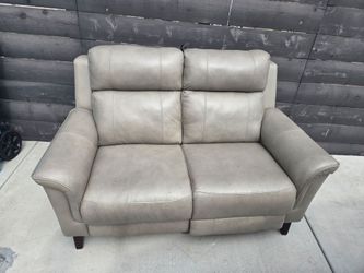 Reclining leather loveseat