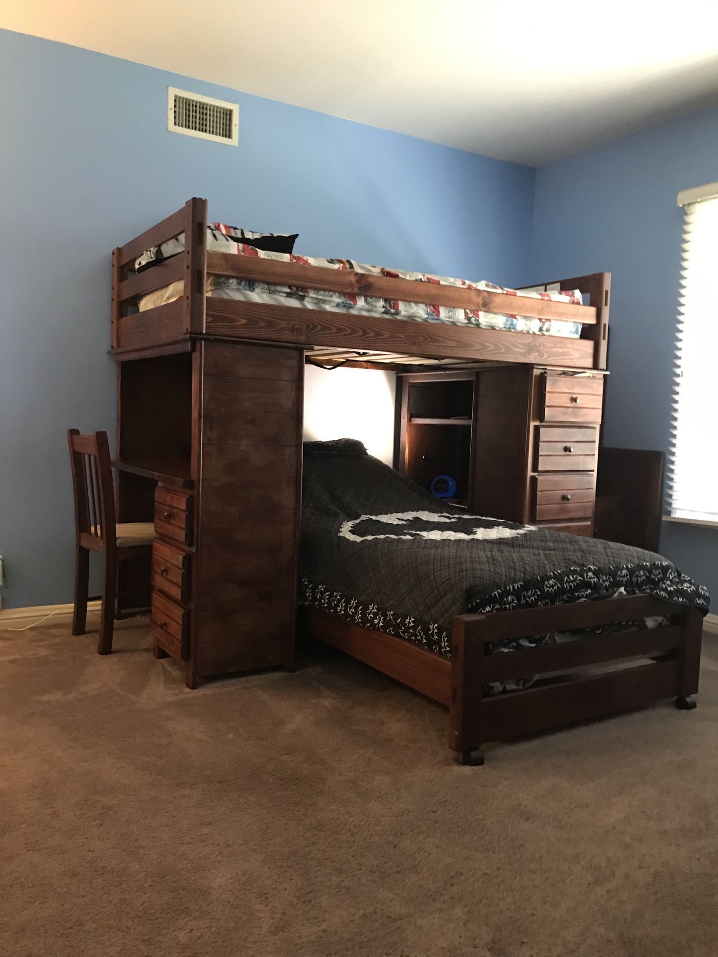 Kids bunk bed with desk and 12 drawers and a dresser with six drawers.