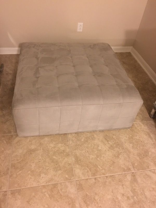 Cindy Crawford Home Calvin Heights Platinum Cocktail Ottoman with wheels underneath for easy moving. Microfiber; 100% Polyester No stains!!