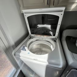 Kenmore Elite Oasis HT top-load washing machine with a glass door