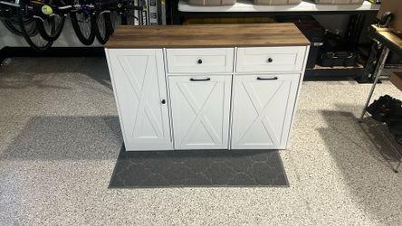 White storage cabinet with wood top