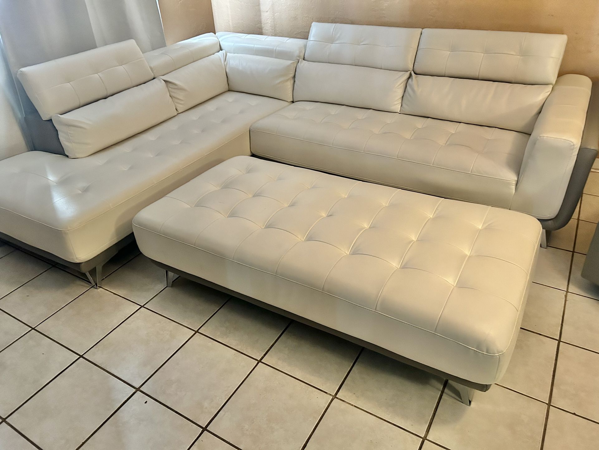Like New 6 Months Old Large 2-tone Leather Sectional Couch With Flip up Headrests And Corner Storage And Ottoman 