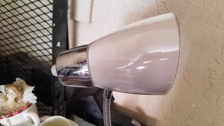 Desk lamp with lots of buns for paperclips etc.