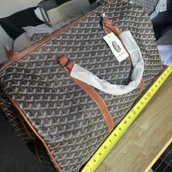Black And Brown Goyard Duffle Bag