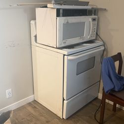 Stove And White Microwave