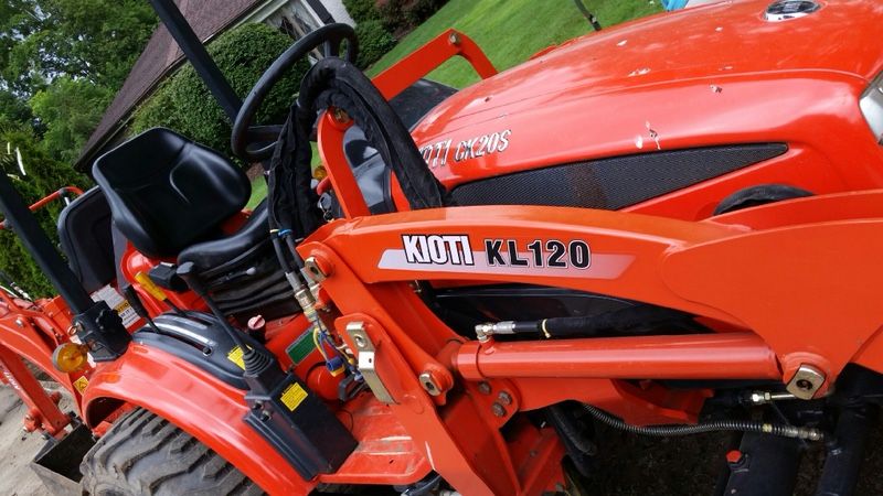 KIOTI tractor with front loader and backhoe attachment