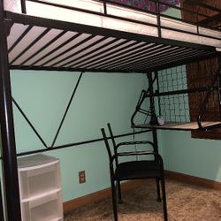 Black metal twin loft bed with attached desk. Includes hardware.