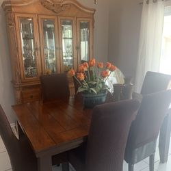 China cabinet with table and six chairs