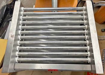 Hot dog roller machine