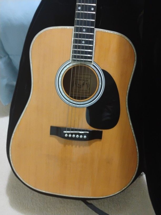 Acoustical Guitar With Pearl Inlay