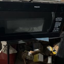 clean New black Hot Point Microwave With Bracket
