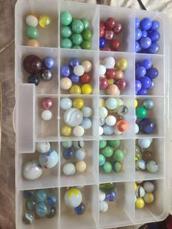 Various Vintage Marbles in plastic storage  container