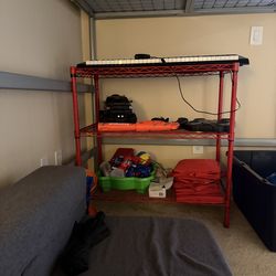 Red metal storage shelf